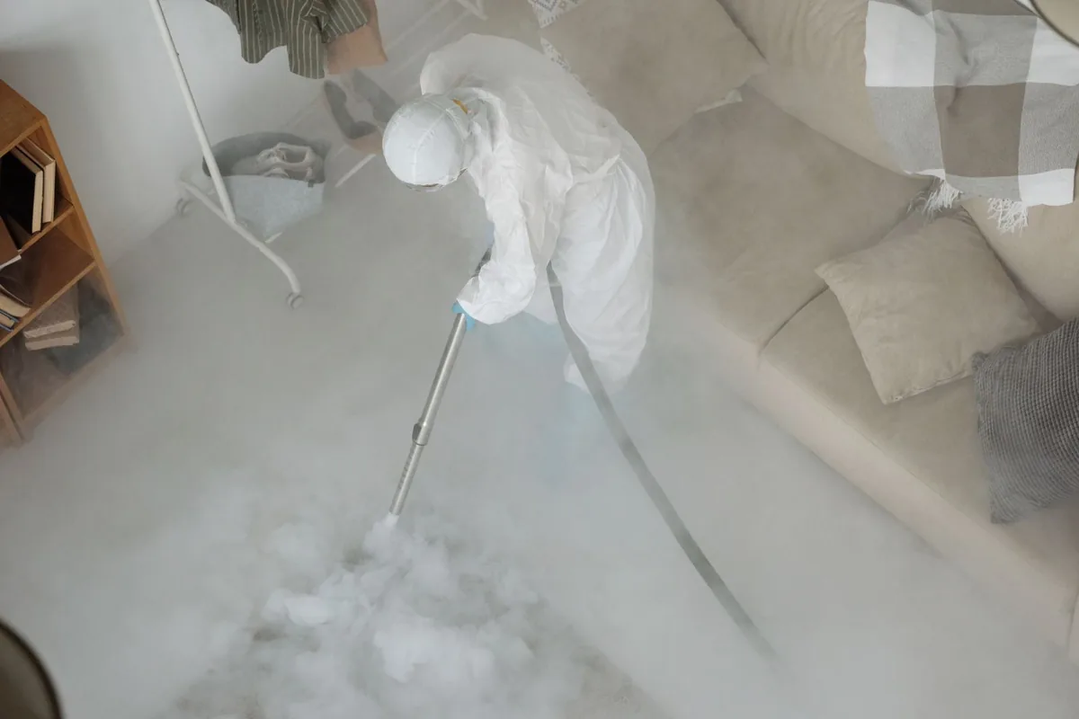 Biohazard cleanup technician in protective equipment, Bay St. Louis, MS